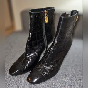 The CHANEL black crocodile-embossed leather ankle boots in size US 8.5, EUR 40